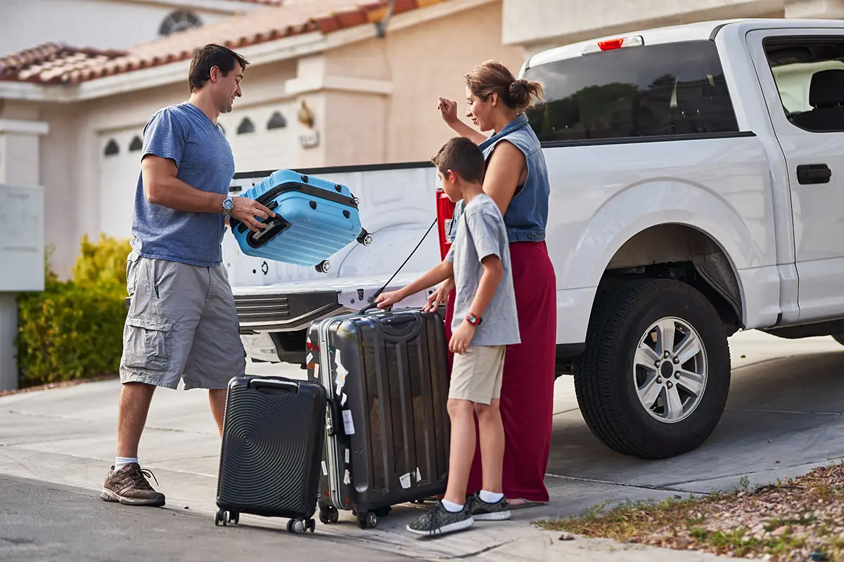 american-family-packing-luggage.webp