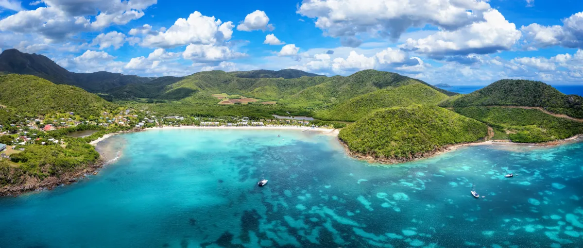 antigua barbuda blue ocean green mountains