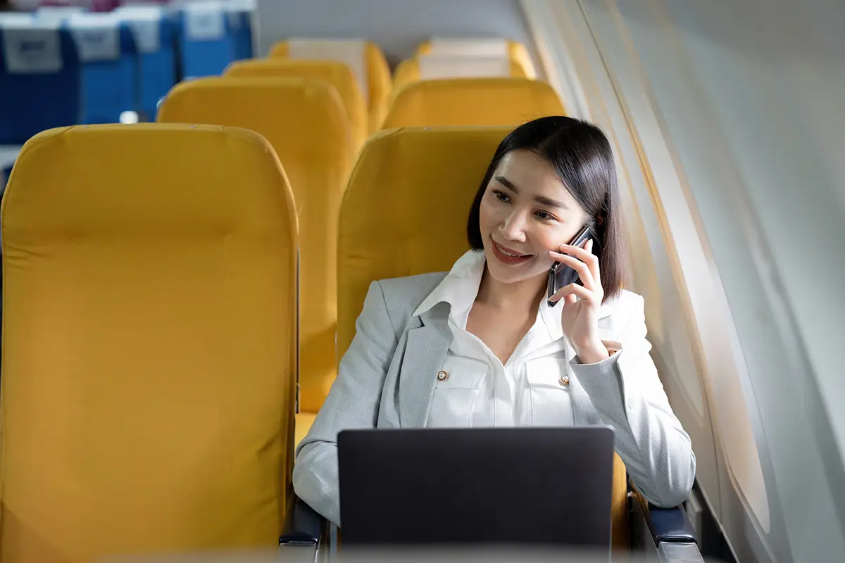 asian-businesswoman-plane.webp