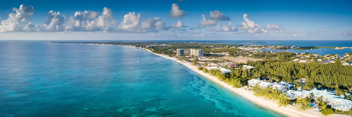 Skyline view of a large stretch of beach in the Cayman Islands.