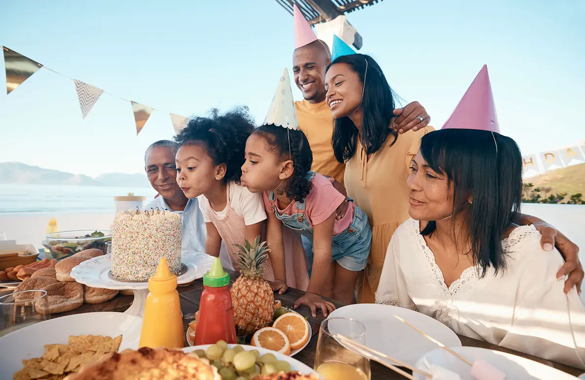 family-birthday-celebration-beach.webp