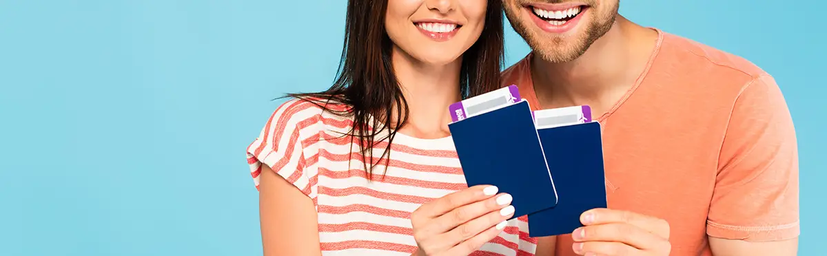 passports-holding-happy-couple.webp