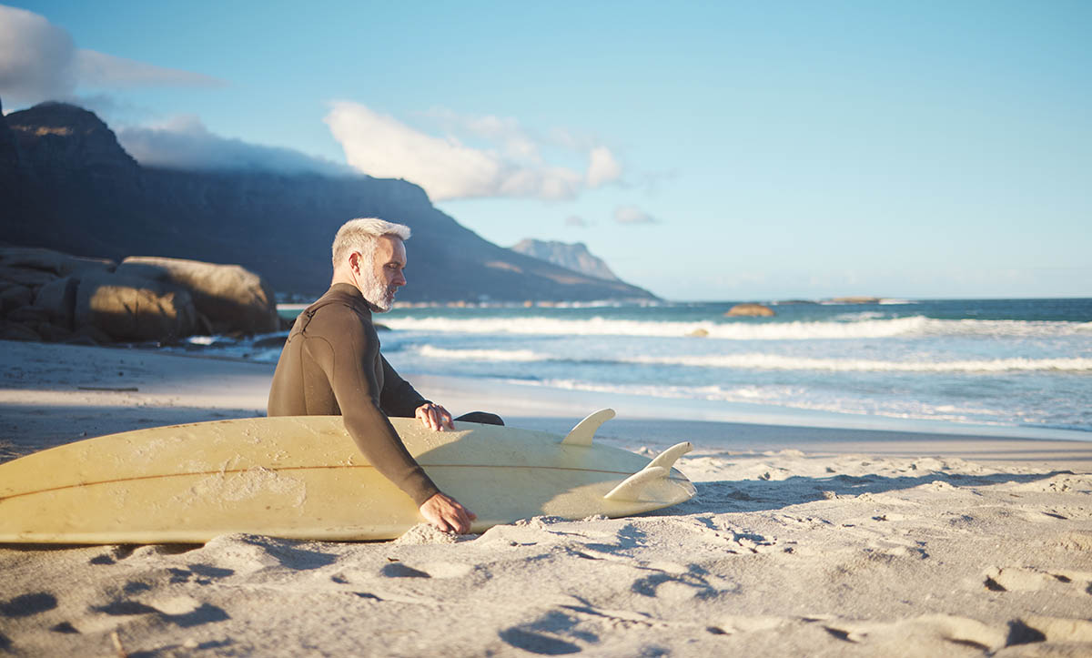 portugal-senior-man-surfing-beach.jpg