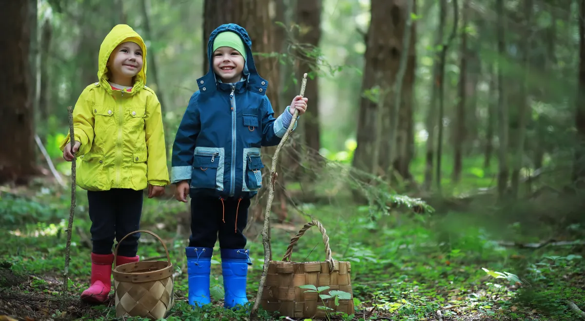 Happy kids playing in a Swedish forest, an excellent choice to raise a family.