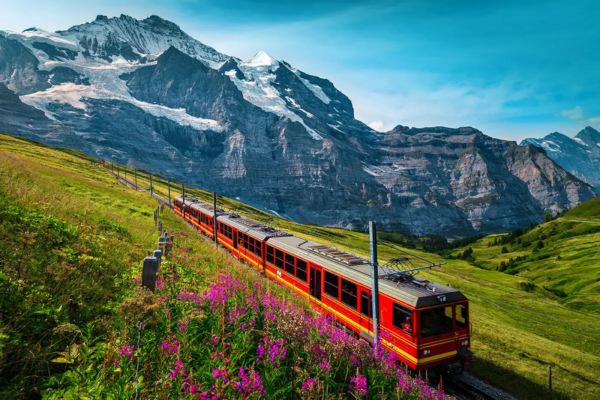 switzerland-jungfrau-mountains-passenger-train.webp